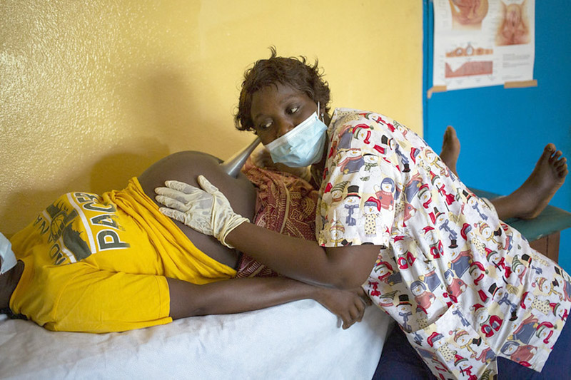 Health worker with patient